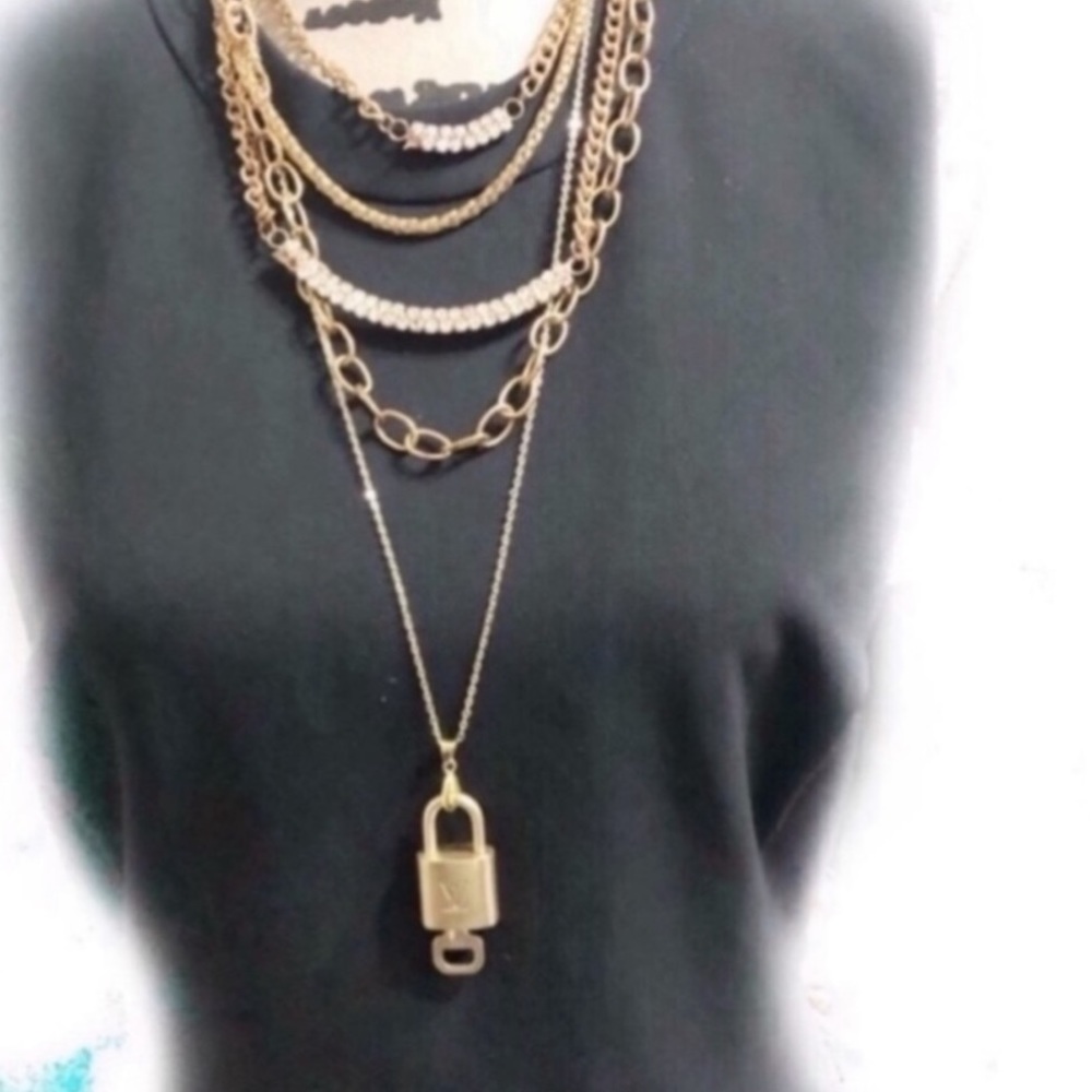 7. Louis Vuitton lock & key with gold necklace
